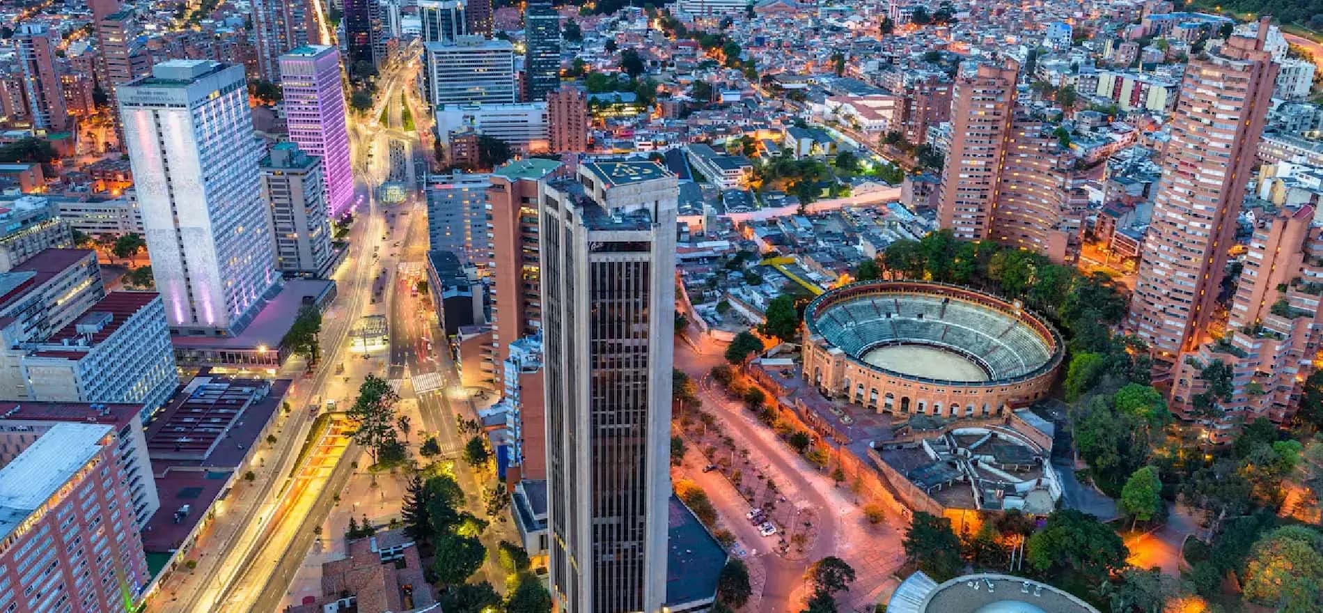 Aerial night view of Bogotá city centre with lit boulevards
