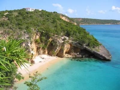 A hidden cove backed by cliffs at Little Bay, Anguilla