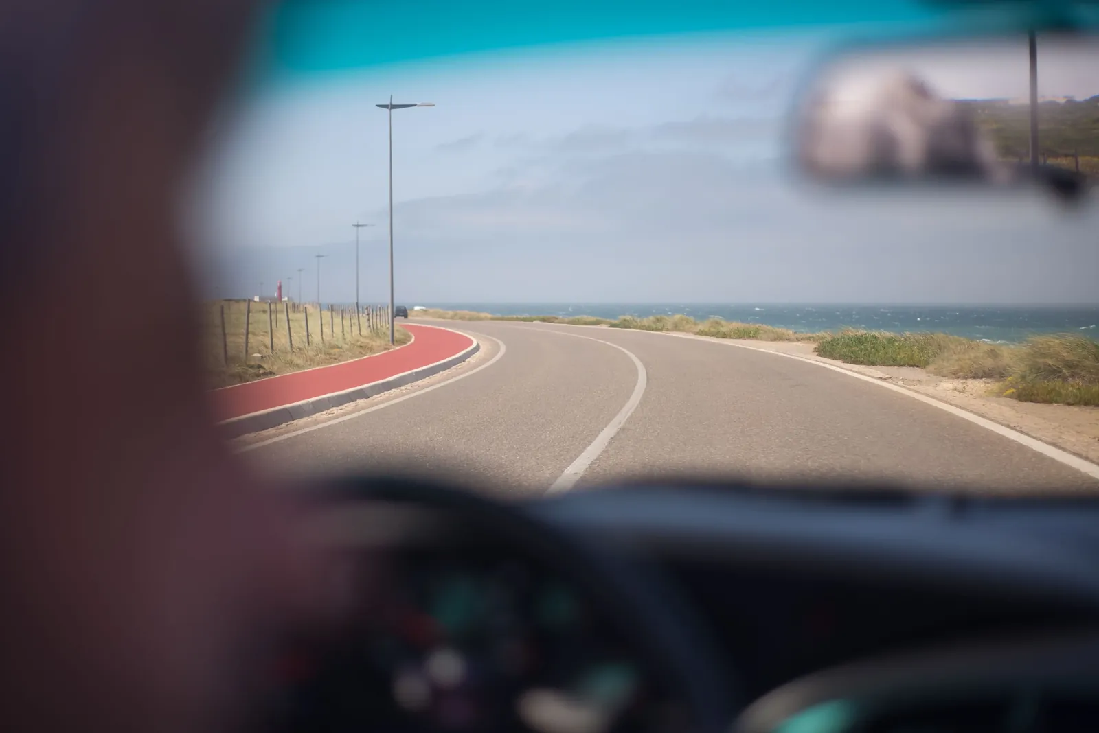 Coastal road curving along the Aruba shoreline