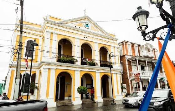 Victorian gingerbread architecture and lush hills of Puerto Plata on the Dominican Republic's north coast