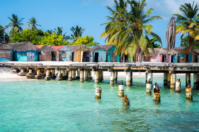 Palm-fringed white sand beach and shallow turquoise pool of Saona Island, Dominican Republic
