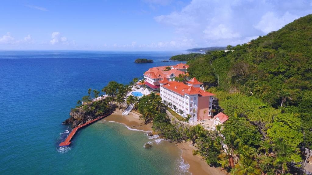 Lush green hillsides and calm bay waters at the Samaná Peninsula, Dominican Republic