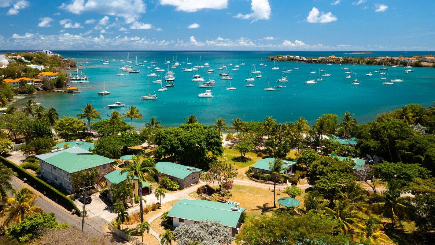 Sheltered yacht-filled bay and low-rise resorts on the Lance aux Épines peninsula, southern Grenada