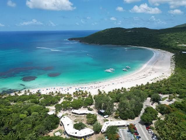 Aerial view of the curving white sand and turquoise water of Flamenco Beach, Culebra