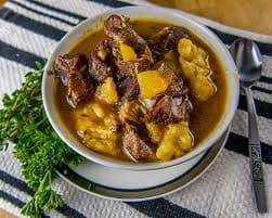 A bowl of goat water, the slow-cooked national stew of Nevis