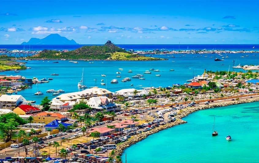 Aerial view of Marigot harbour in French Saint-Martin, with boats moored in the bay