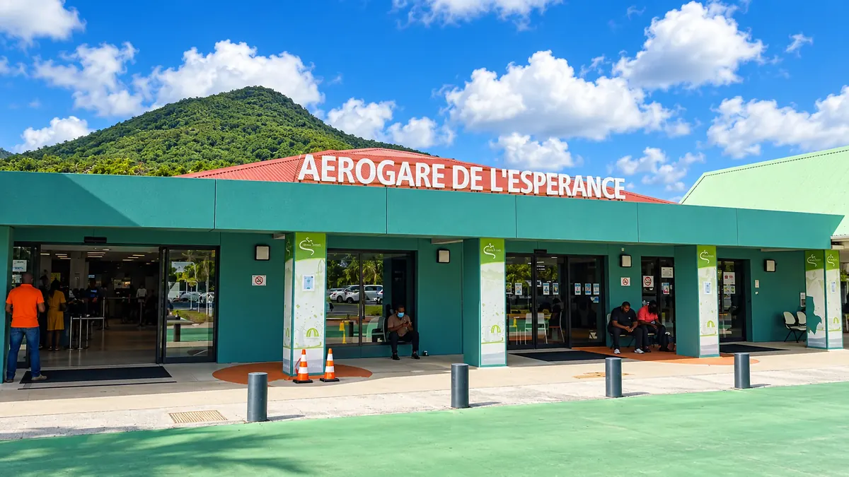 The terminal at Grand Case–Espérance Airport (SFG) in French Saint-Martin, with the “Aérogare de L’Espérance” sign