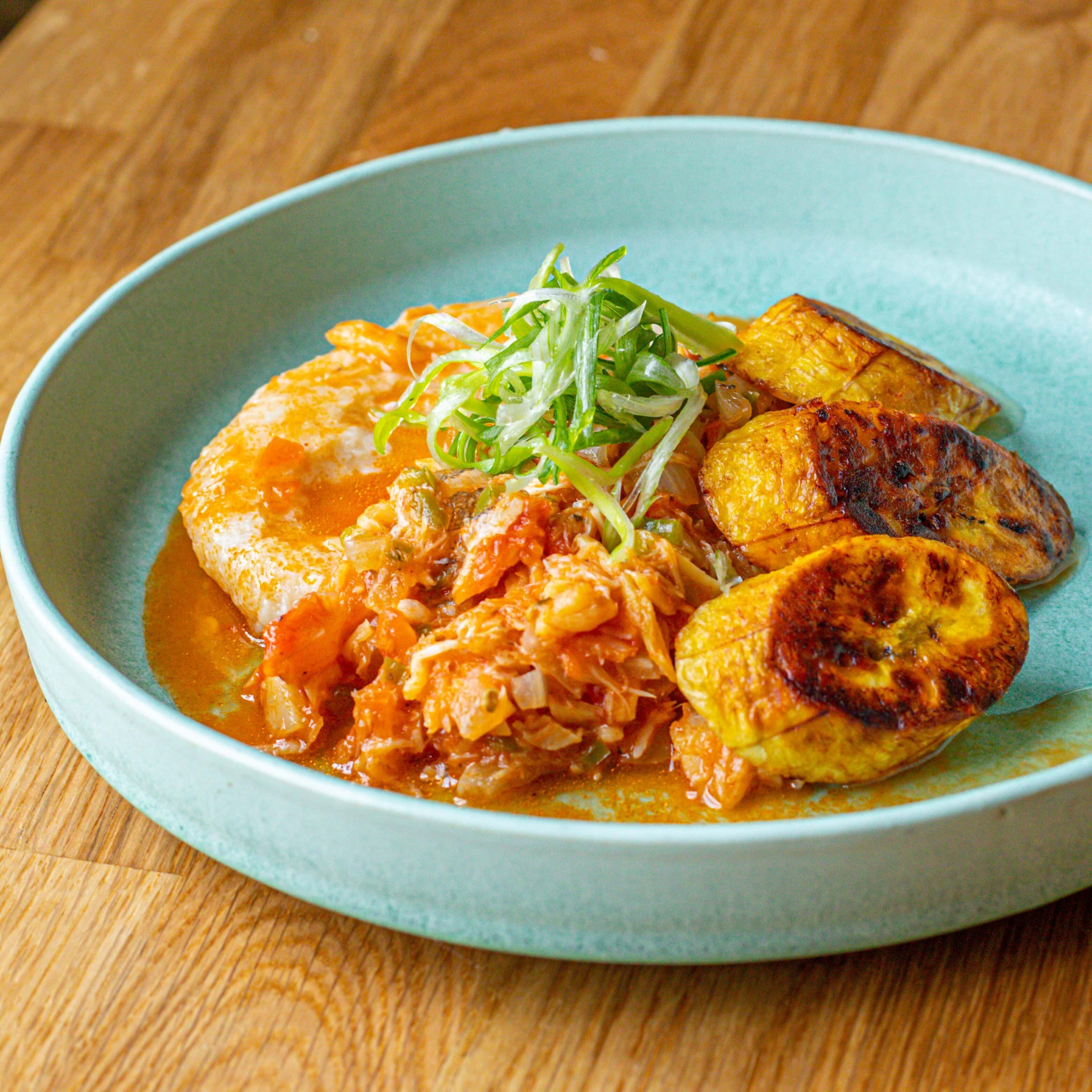 Stewed saltfish with fried plantain and coconut dumplings, the national dish of St. Kitts and Nevis