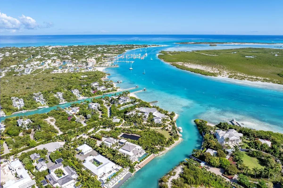 Aerial view of the Leeward channel and marina, with villas along the water's edge