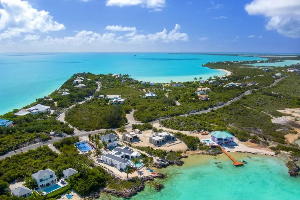 Aerial view of villas and shallow turquoise water around Taylor Bay