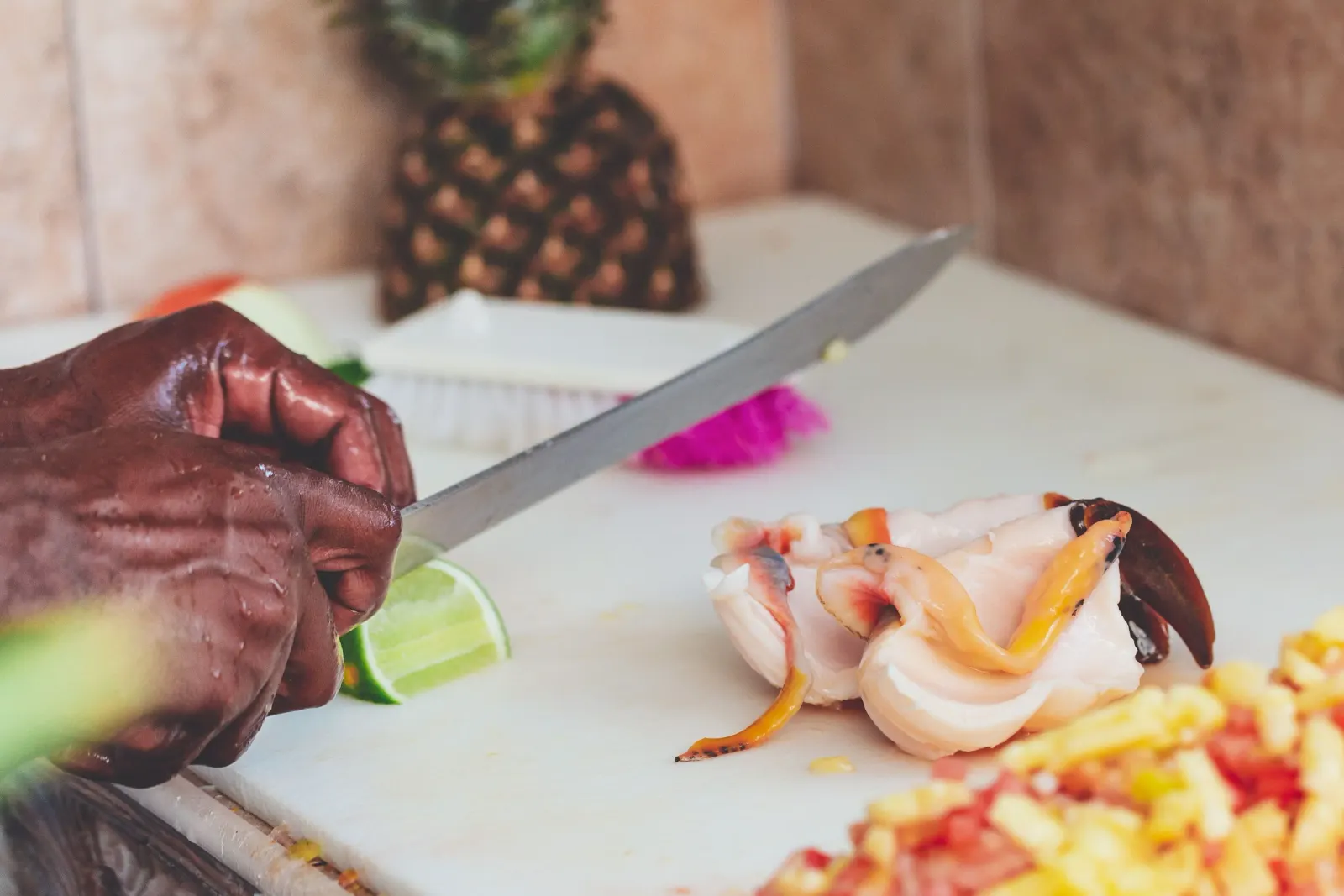 Local chef preparing fresh seafood in Aruba