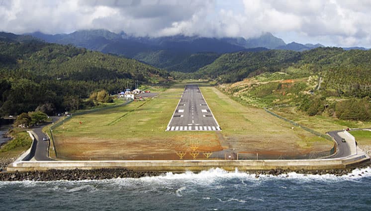 Douglas–Charles Airport runway on the coast, Dominica