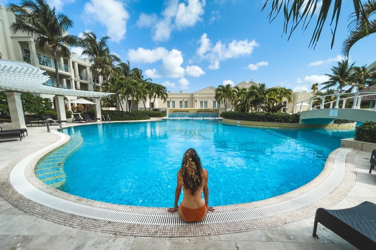 Modern white beachfront villas with loungers on the sand, North Caicos